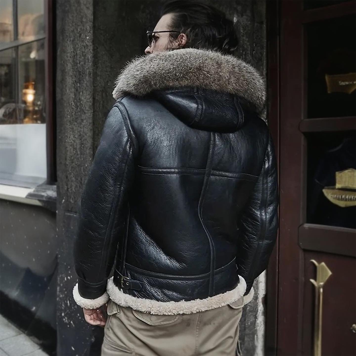 Mens Vintage Black Aviator Pilot Fur Hooded Shearling Leather Jacket-Men’s hooded shearling leather jacket – black vintage aviator style with sheepskin lining, fur hood, and bomber design.